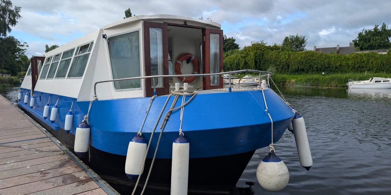 The Barge Docked by the Pier 