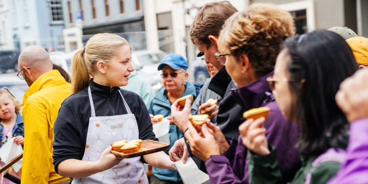 visitors sampling local cuisine 